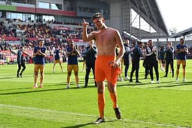 Newcastle United goalkeeper Nick Pope applauds the club's fans after the Brentford win.