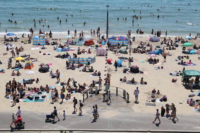 Crowds gather on the beach in Bournemouth. Picture by PA