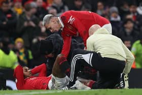 Manchester United's Marcus Rashford receives treatment last night.