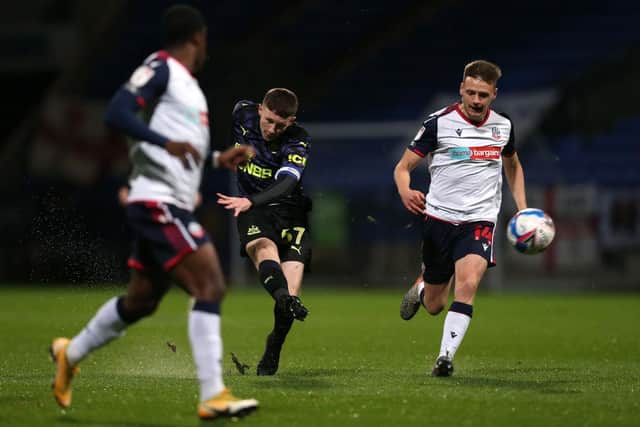 Elliot Anderson of Newcastle United U21's scores during the EFL Trophy match between Bolton Wanderers and Newcastle United U21 at University of Bolton Stadium on November 17, 2020 in Bolton, England.