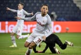 Salzburg's Swiss midfielder Noah Okafor celebrates after scoring a goal during the UEFA Champions League Group G football match RB Salzburg v Sevilla in Salzburg, Austria on December 8, 2021. - Austria OUT (Photo by HANS PUNZ / APA / AFP) / Austria OUT (Photo by HANS PUNZ/APA/AFP via Getty Images)