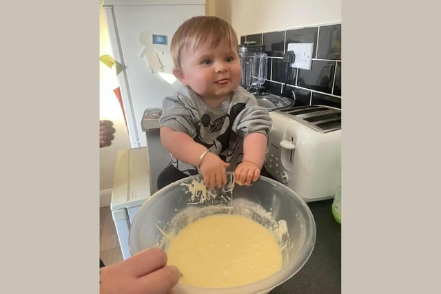 Star baker of the future. Chester, age 13 months, gets stuck into making some cupcakes.