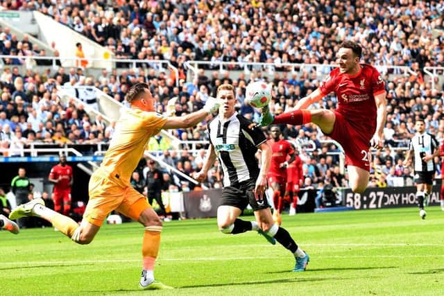 Diogo Jota of Liverpool with Newcastle's Martin Dubravka during the Premier League match between Newcastle United and Liverpool at St. James Park on April 30, 2022 in Newcastle upon Tyne, England. (Photo by John Powell/Liverpool FC via Getty Images)