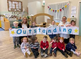 Deputy manager Hayley Rochford and manager Kathryn Pino celebrate the nursery's outstanding Ofsted with the children.
