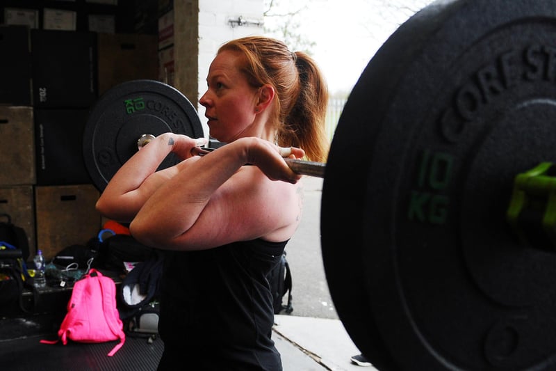 Gym-goer seen making the most of the weights at Crossfit 1298 in Falkirk as it reopens to members again.