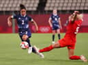 Demi Stokes of Team GB is challenged by Adriana Leon of Team Canada during the Women's Group E match on day four of the Tokyo 2020 Olympic Games at Kashima Stadium on July 27, 2021 in Kashima, Ibaraki, Japan. (Photo by Atsushi Tomura/Getty Images)