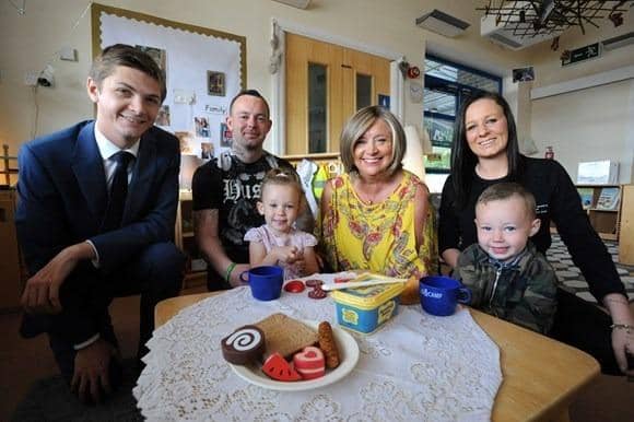 Cllr Adam Ellison (left) at STANLEYS with Nathan and Samantha Young, their children Louisiana and Tommy-Paul, and nursery manager Andrea King (centre).