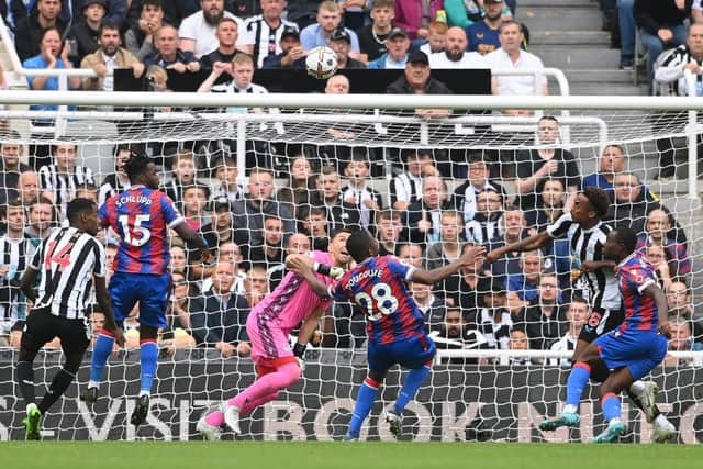 Newcastle player Joe Willock is challenged by Tyrick Mitchell and  Vicente Guaita is beaten but the goal is disallowed after a VAR review during the Premier League match between Newcastle United and Crystal Palace at St. James Park on September 03, 2022 in Newcastle upon Tyne, England. (Photo by Stu Forster/Getty Images)