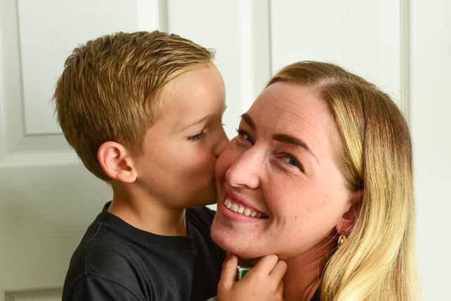 Grayson Stewart gives mum Regan Deeley a kiss after saving her life