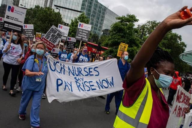 NHS staff take part in a march through central London, demanding a pay rise on the service's 73rd birthday in summer 2021. Picture: Chris J Ratcliffe/Getty Images.