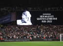 The LED board shows a photo Queen Elizabeth II as players of West Ham United and FCSB observe a minutes silence after it was announced that Queen Elizabeth II has passed away last night.