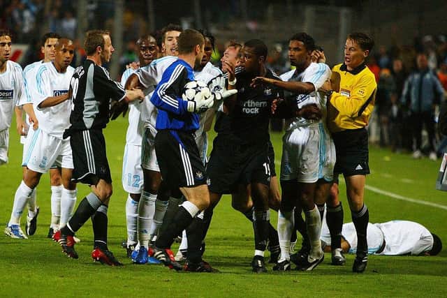 MARSEILLE, FRANCE - MAY 6: Shay Given of Newcastle United tries to stop the melee as Marseille players argue with Lee Bowyer after his tackle during the UEFA Cup Semi-Final, Second Leg match between Olympique De Marseille and Newcastle United at the Stade Velodrome on May 6, 2004 in Marseille, France. (Photo by Christopher Lee/Getty Images)
