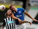 Dan Burn in action for Brighton against Newcastle United (Photo by LEE SMITH/POOL/AFP via Getty Images)