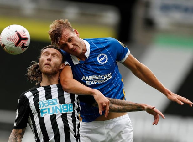 Dan Burn in action for Brighton against Newcastle United (Photo by LEE SMITH/POOL/AFP via Getty Images)