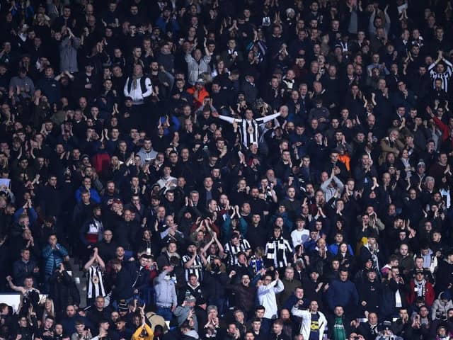 WEST BROMWICH, ENGLAND - MARCH 03: Newcastle United fans celebrate during the FA Cup Fifth Round match between West Bromwich Albion and Newcastle United at The Hawthorns on March 03, 2020 in West Bromwich, England. (Photo by Nathan Stirk/Getty Images)