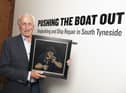 Robert Olley holding his original oil painting entitled ‘Fag Break’