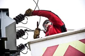 A worker carries out repairs.