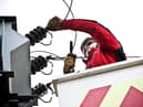 A worker carries out repairs.