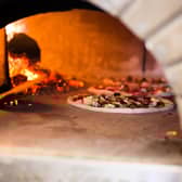 The pizzeria would have an authentic wood-fired oven