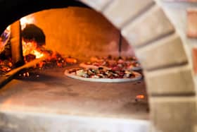 The pizzeria would have an authentic wood-fired oven
