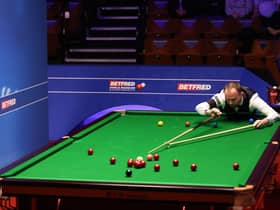 Mark Joyce lines up a shot during the Betfred World Snooker Championships 2021. Picture by PA