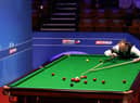 Mark Joyce lines up a shot during the Betfred World Snooker Championships 2021. Picture by PA