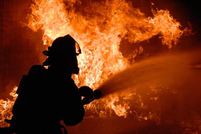Stock image from Pixabay of a firefighter in action