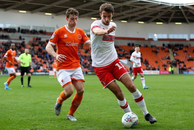 Dan Barlaser, right, playing for Rotherham United.