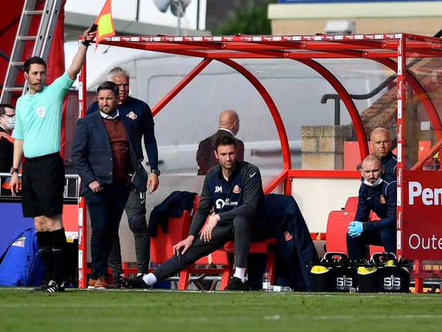 Lee Johnson watches on at the LNER Stadium as Sunderland fall to a 2-0 defeat