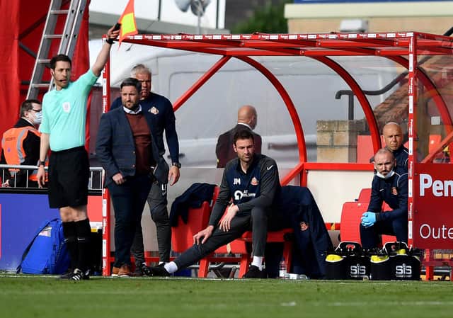 Lee Johnson watches on at the LNER Stadium as Sunderland fall to a 2-0 defeat