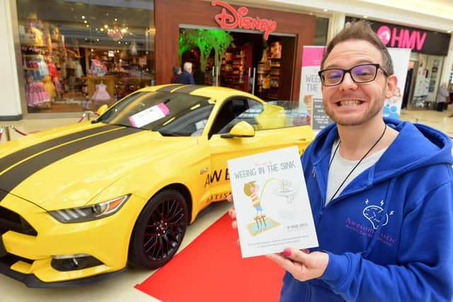 Richie Smith signing copies of his book in the Bridges Shopping Centre, Sunderland.