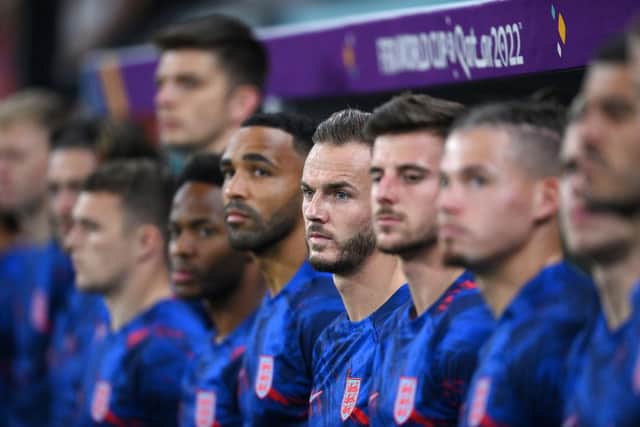 James Maddison and England substitute players line up for the national anthem prior to the FIFA World Cup Qatar 2022 Group B match between Wales and England at Ahmad Bin Ali Stadium on November 29, 2022 in Doha, Qatar. (Photo by Laurence Griffiths/Getty Images)