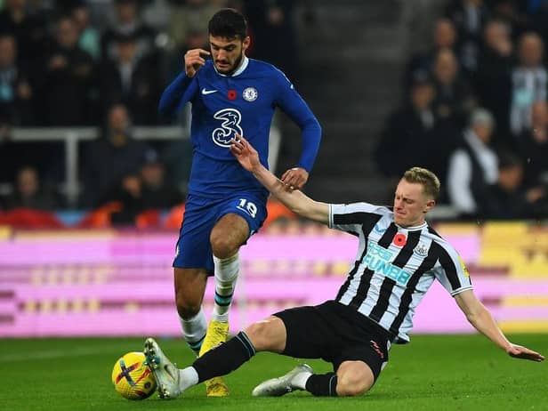 Chelsea's Albanian forward Armando Broja (L) vies with Newcastle United's English midfielder Sean Longstaff (R) during the English Premier League football match between Newcastle United and Chelsea at St James' Park in Newcastle-upon-Tyne, north east England on November 12, 2022. (Photo by ANDY BUCHANAN/AFP via Getty Images)