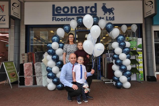 Paul Leonard, partner Nicola, children Noah and Laura, opening their new flooring shop in Jarrow's Viking Shopping Centre 5 years ago.