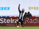 NEWCASTLE UPON TYNE, ENGLAND - JUNE 21: Allan Saint-Maximin of Newcastle United takes a knee as he celebrates after scoring his sides first goal during the Premier League match between Newcastle United and Sheffield United at St. James Park on June 21, 2020 in Newcastle upon Tyne, England.