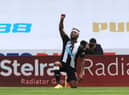 NEWCASTLE UPON TYNE, ENGLAND - JUNE 21: Allan Saint-Maximin of Newcastle United takes a knee as he celebrates after scoring his sides first goal during the Premier League match between Newcastle United and Sheffield United at St. James Park on June 21, 2020 in Newcastle upon Tyne, England.