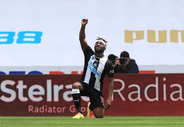 NEWCASTLE UPON TYNE, ENGLAND - JUNE 21: Allan Saint-Maximin of Newcastle United takes a knee as he celebrates after scoring his sides first goal during the Premier League match between Newcastle United and Sheffield United at St. James Park on June 21, 2020 in Newcastle upon Tyne, England.