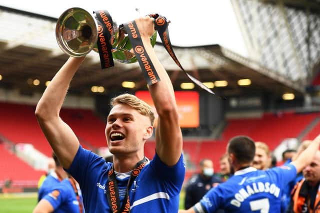 Lewis Cass of Hartlepool United celebrates with the trophy following the Vanarama National League Play-Off Final match between Hartlepool United and Torquay United at Ashton Gate on June 20, 2021 in Bristol, England. (Photo by Harry Trump/Getty Images)