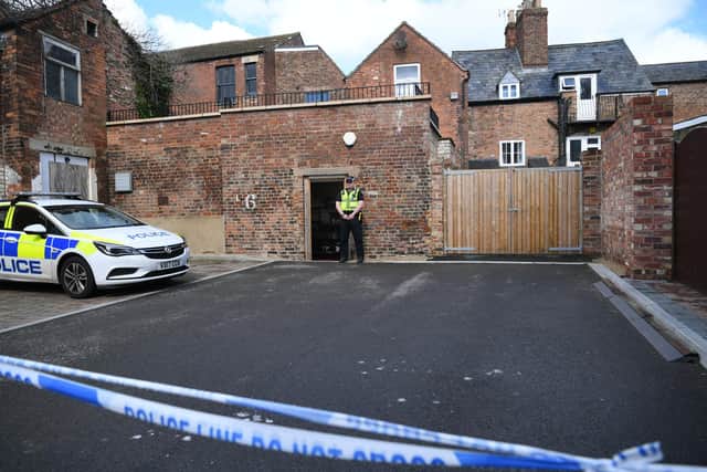 Police activity at the rear of The Clean Plate cafe in Southgate Street, Gloucester where excavation work is to begin after police found "possible evidence" of where a suspected teenage victim of serial killer Fred West may be buried. Forensic archaeologists have been undertaking exploratory work in connection with the disappearance of 15-year-old Mary Bastholm who was last seen alive in January 1968. Picture date: Wednesday May 19, 2021.