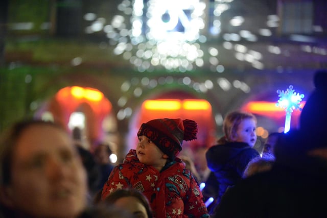 Little boy enjoying the show at the Christmas Light switch-on