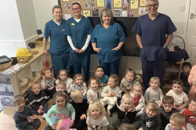 Dental experts and youngsters at Nurserytime.