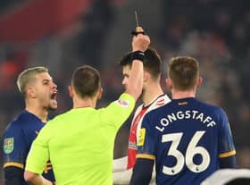 Duje Caleta-Car of Southampton is shown a red card by Referee Stuart Attwell, after fouling Allan Saint-Maximin of Newcastle United (not pictured), during the Carabao Cup Semi Final 1st Leg match between Southampton and Newcastle United at St Mary's Stadium on January 24, 2023 in Southampton, England. (Photo by Mike Hewitt/Getty Images)