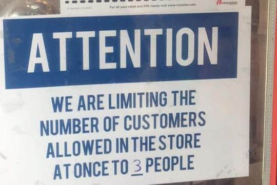 Only three customers are allowed in the store at one time.