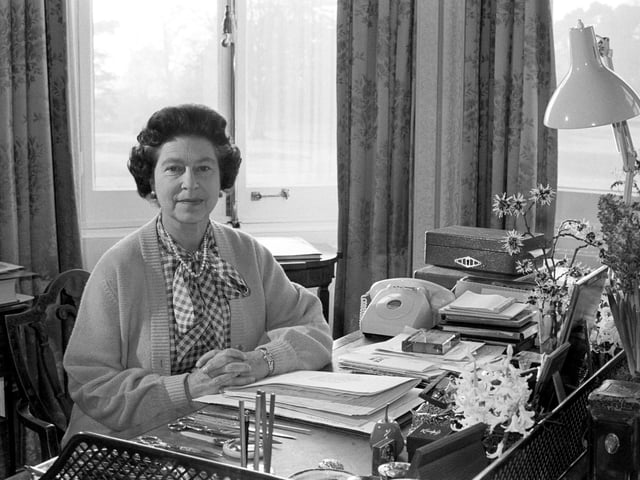 Queen Elizabeth II, at her desk in the study of Sandringham House, her Norfolk home, where she marked her 30th anniversary of her accession to the throne. 07/02/82