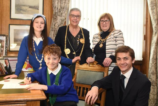 Westoe Crown Primary School pupils Sonny (aged 8) and Laila (aged 9) undertake ‘official’ signings overseen by the Mayor and Mayoress of South Tyneside and Lead Member for Children, Young People and Families, Councillor Adam Ellison.