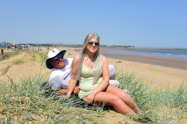 Michael Turnbull and Claire Henderson relax on the dunes