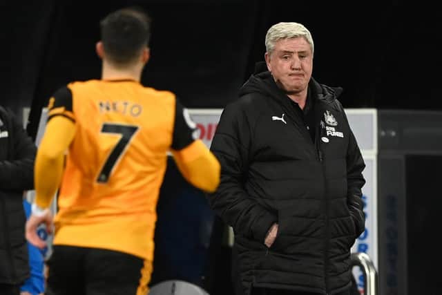 Newcastle United's English head coach Steve Bruce (R) looks on during the English Premier League football match between Newcastle United and Wolverhampton Wanderers at St James' Park in Newcastle-upon-Tyne, north east England on February 27, 2021.