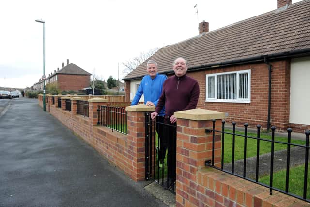 Cllr John McCabe, left, with Hexham Avenue resident Ronnie Miller beside his new wall.