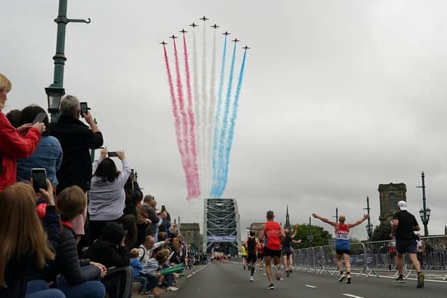 The Red Arrows fly over competitors in the 2021 Great North Run.