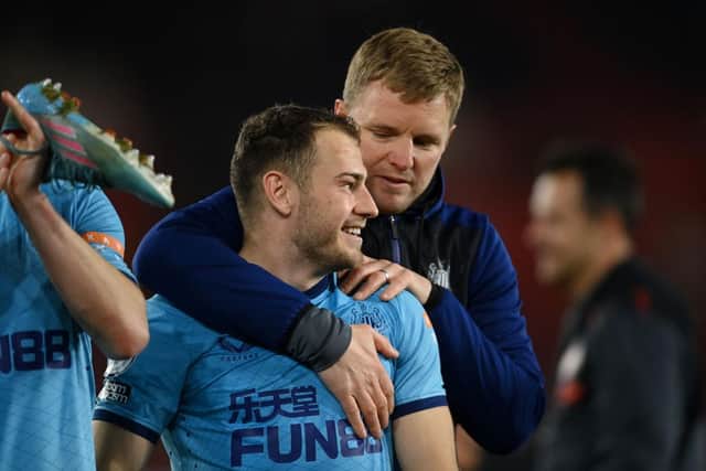 Ryan Fraser of Newcastle United is embraced by Eddie Howe, Head Coach of Newcastle United, after the final whistle of Premier League match between Southampton and Newcastle United at St Mary's Stadium on March 10, 2022 in Southampton, England. (Photo by Mike Hewitt/Getty Images)